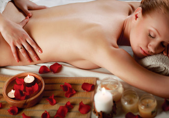 Beautiful young woman getting spa massage