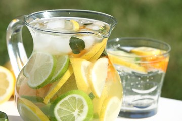 Detail of jug with fresh lemonade outdoor in summer day