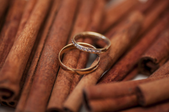 two golden wedding rings on canella