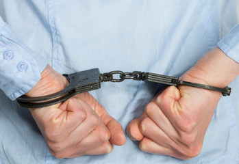 Hands in handcuffs