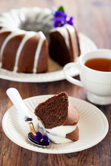 Chocolate bundt cake with icing, selective focus