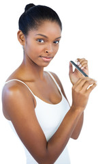 Young woman using nail file