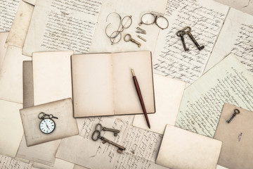 open book, vintage accessories, old letters and postcards