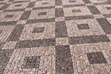 cobbled pavement in symmetrical patterns