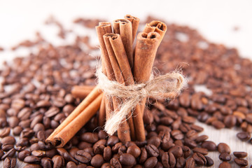 cinnamon sticks and scattered coffee beans