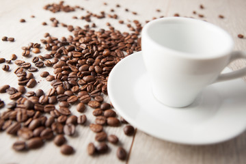 empty coffee cup with scattered beans