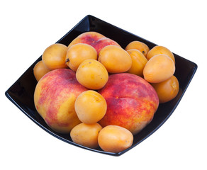 peaches and apricots in black plate