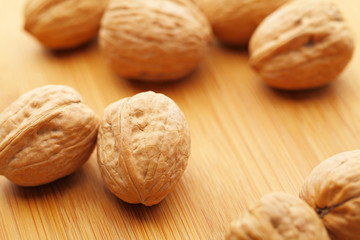 Walnut on wooden table