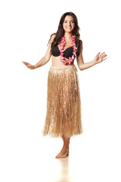 beautiful brunette dance in straw skirts and flower necklace