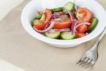 served plate with mix salad from tomatoes and cucumbers