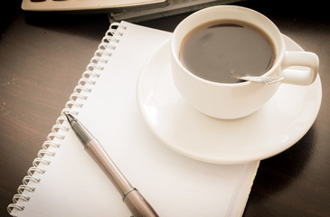Obraz na płótnie Canvas Coffee and the calculator and pen