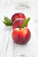 Fresh and tasty peaches on a table