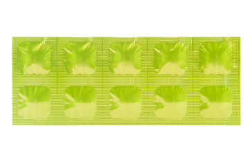 Tablet in green aluminum strip pack