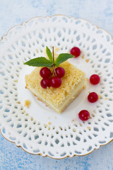 A  piece of crumb cake with cream cheese