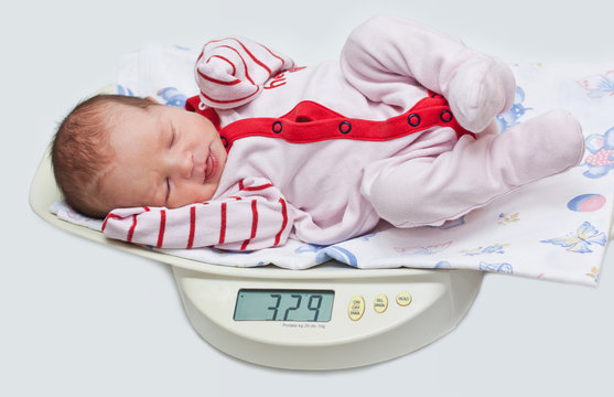 cute baby on the scales