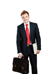 Portrait of successful business man with bag and holding laptop