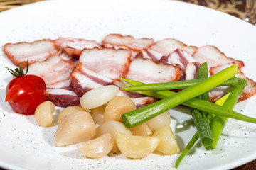 bacon, onion and pepper on a plate in a restaurant