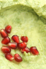 Homemade guacamole with pomegranate seeds