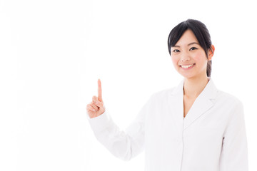 attractive asian doctor showing on white background
