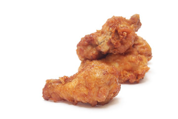 fried chicken drumsticks on white background
