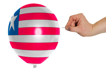 Bursting balloon colored in  national flag of liberia