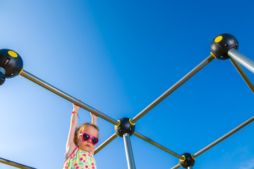 Girl and jungle gym