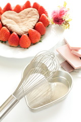 egg beater and homemade cake for valentine's day image