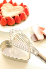 egg beater and homemade cake for valentine's day image