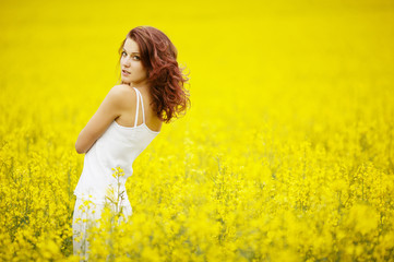 young beautiful girl in the field