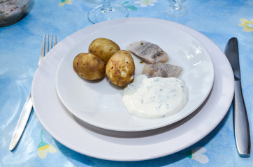 Dish of potatoes and sliced herring