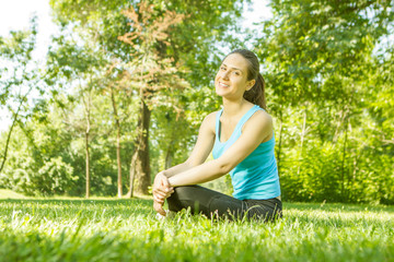 Happy fitness girl relaxing