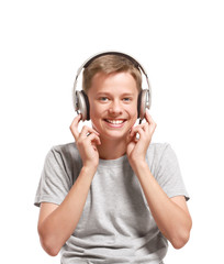 Smiling teenage boy listening to music
