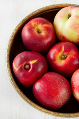 nectarine in dish on table