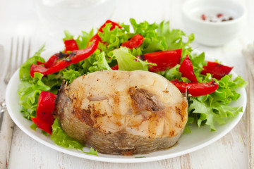 fried fish with salad