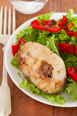 fish with salad on white plate