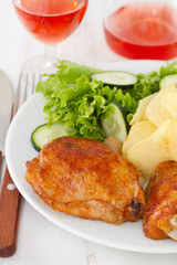 fried chicken with potato chips and salad