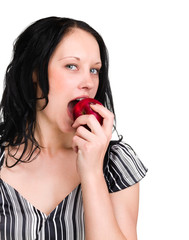 woman holding an apple she's about to eat