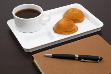 Cup of coffee and book