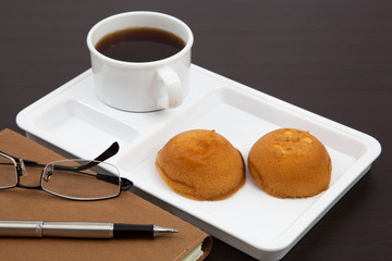 Cup of coffee and book