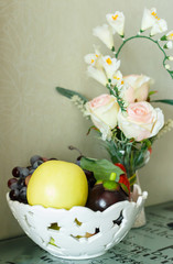Beautiful still life with white roses and fruit