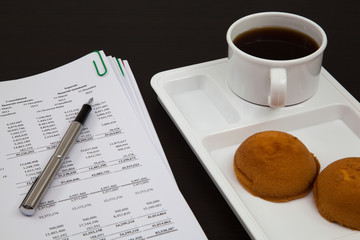 Business report and cup of coffee