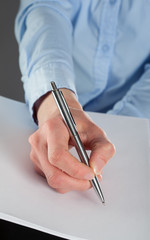 Businesswoman writing on a blank paper, you can add your text