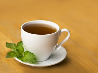 cup of aromatic tea on wooden table