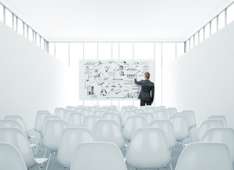 presentation room and businessman drawing strategy
