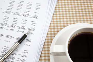 Business report and cup of coffee