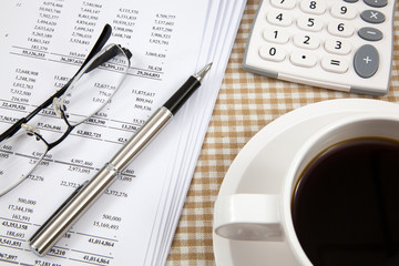 Business report and cup of coffee