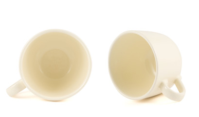 Ceramic cream colored cup isolated