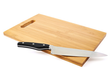Steel kitchen knife on cutting board