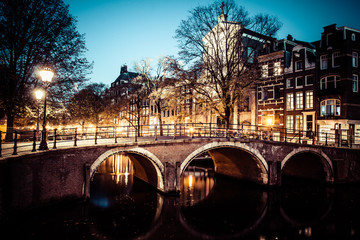 One of the famous canals of Amsterdam, the Netherlands at dusk. © Curioso.Photography