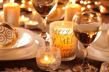 Detail of table with holiday setting and Christmas decorations